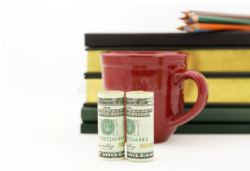 Accounting success seen in American currency, red mug, pencils, royalty free stock image Accounting success seen in American currency, red mug, pencils, royalty free stock image