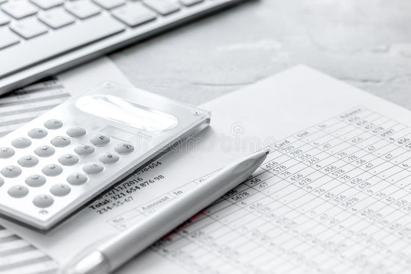 Accounting work space with calculator, profit and tables on stone desk close up royalty free stock photos Accounting work space with calculator, profit and tables on stone desk close up royalty free stock photos