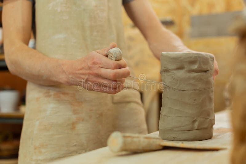 Accurate Master Cutting Necessary Piece of Clay with Wire Tool Stock
