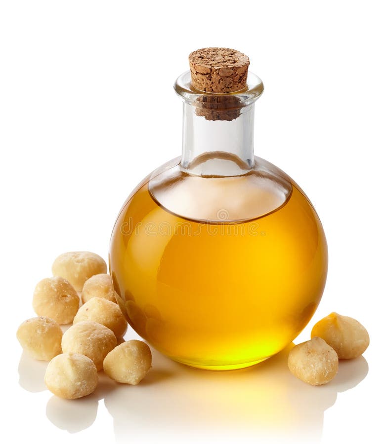 Bottle of macadamia nut oil isolated on white background. Bottle of macadamia nut oil isolated on white background