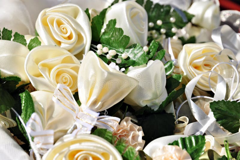 Wedding accessories: artificial roses from textile material for an ornament. Wedding accessories: artificial roses from textile material for an ornament.