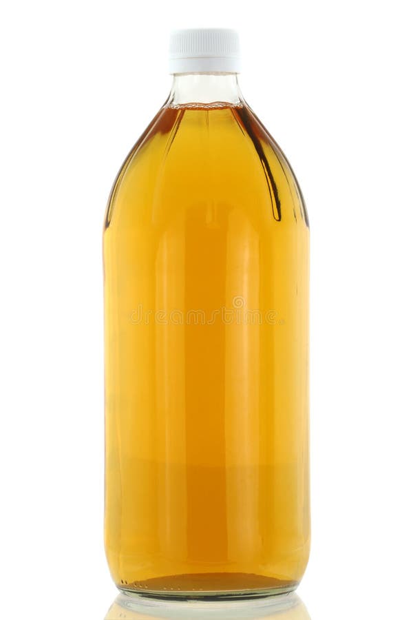 A bottle of filtered Apple Cider Vinegar isolated on white. A bottle of filtered Apple Cider Vinegar isolated on white