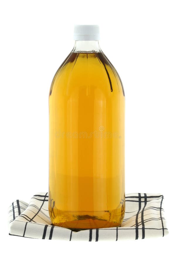 A bottle of filtered Apple Cider Vinegar isolated on white. A bottle of filtered Apple Cider Vinegar isolated on white