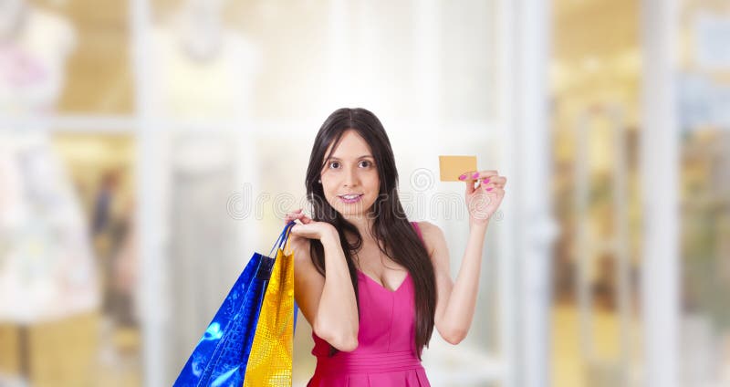 Achats de femme avec la carte de cr?dit images stock Achats de femme avec la carte de cr?dit images stock