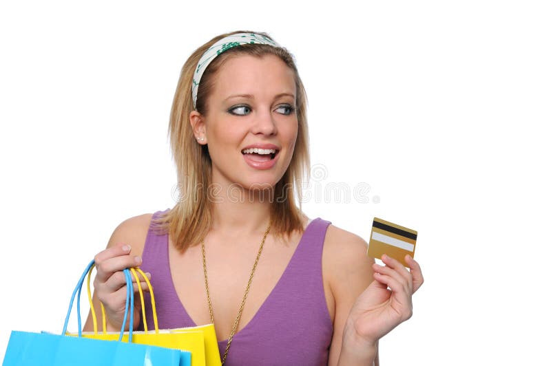 Achats et payind de l'adolescence avec un par la carte de crédit photographie stock Achats et payind de l'adolescence avec un par la carte de crédit photographie stock