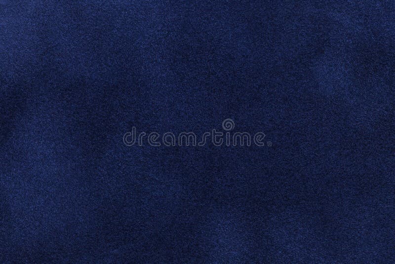 Achtergrond van de donkerblauwe close-up van de suèdestof Fluweel matte textuur van marineblauwe nubucktextiel