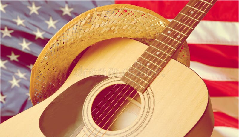 Acoustic guitar close up on american flag