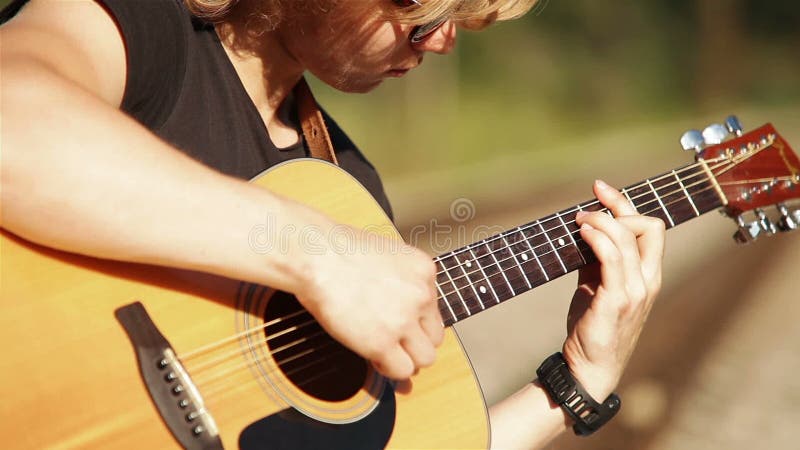Acoustic Guitar long haired blond player