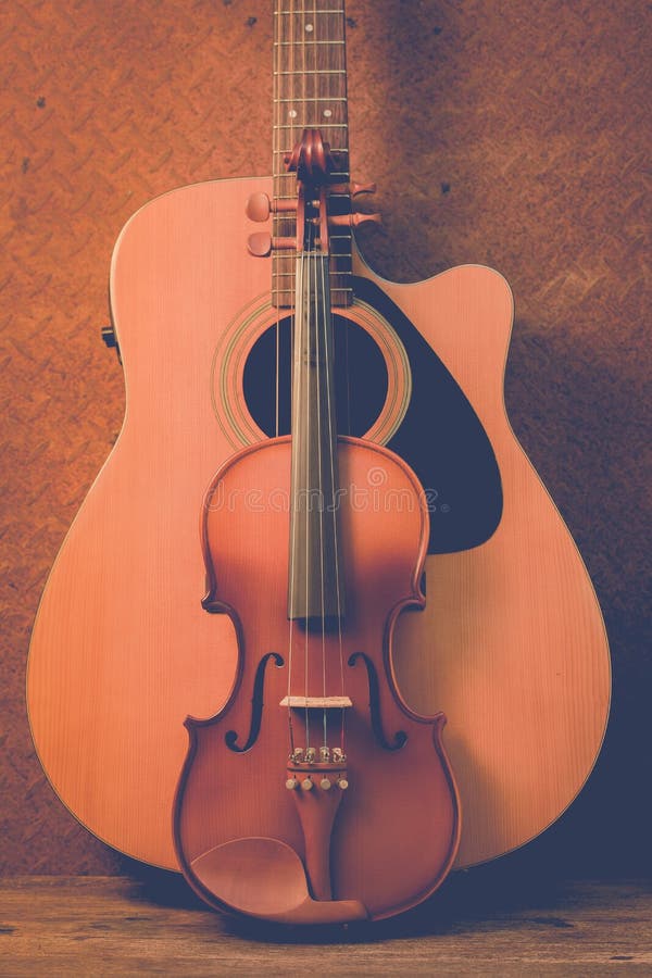 Acoustic guitar and violin stock photo. Image of interior 65306464
