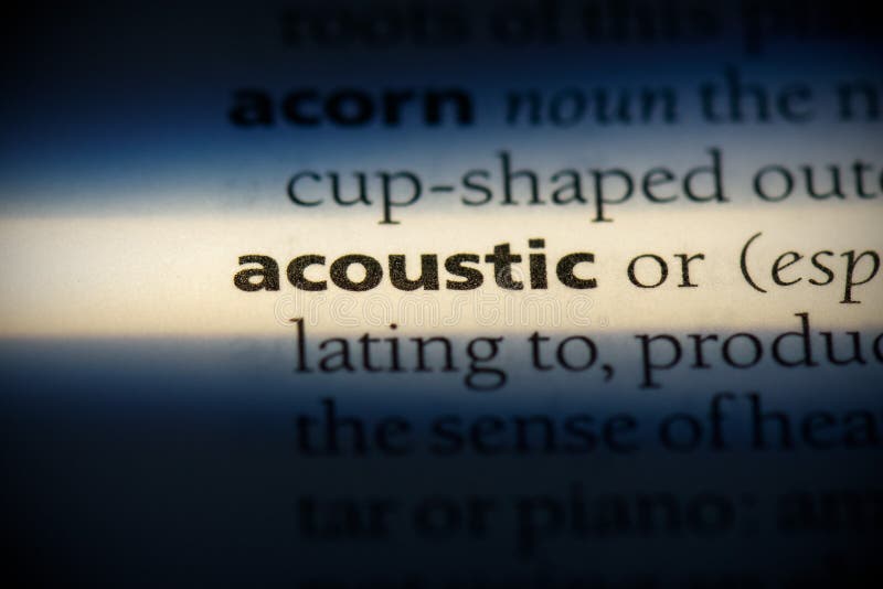 Word Acoustic with Wooden Letters, Closeup on a Surface of Red Acoustic