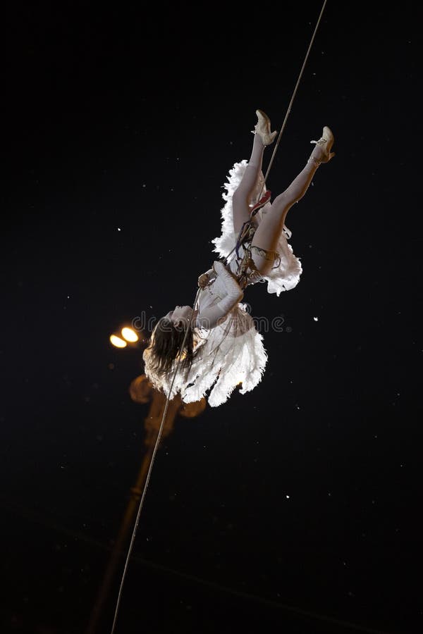 Acrobat gliding down a rope royalty free stock image Acrobat gliding down a rope royalty free stock image