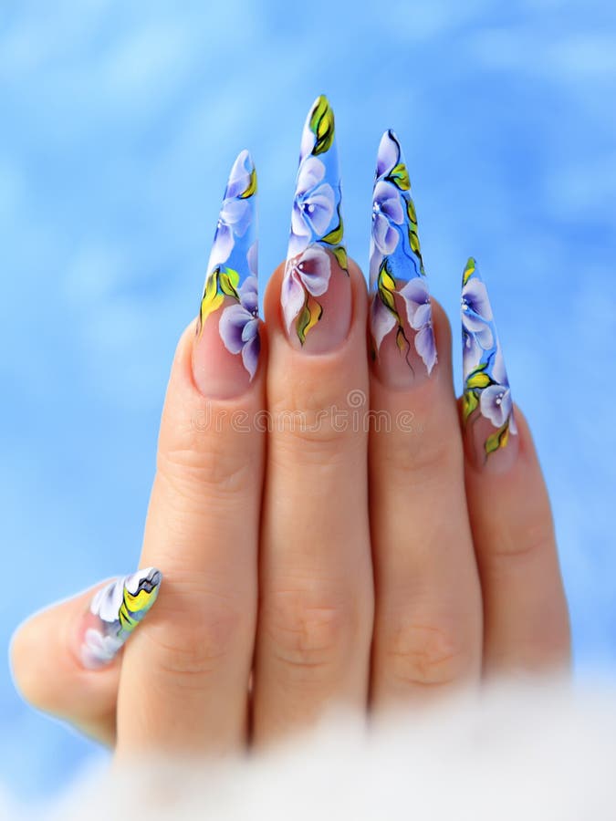 Acrylic flowers on women s nails.