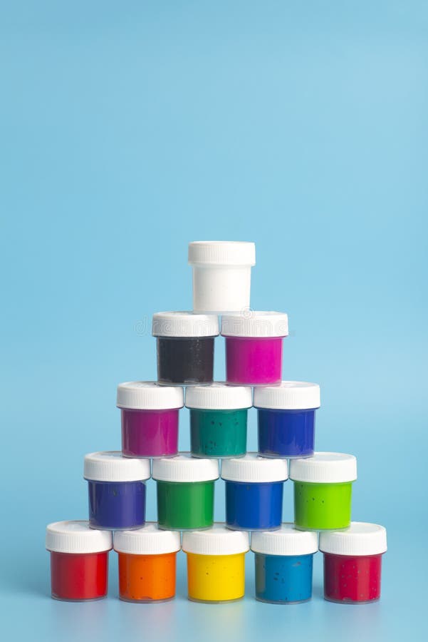 Acrylic Paint of Different Colors on a Blue Background. Paint for