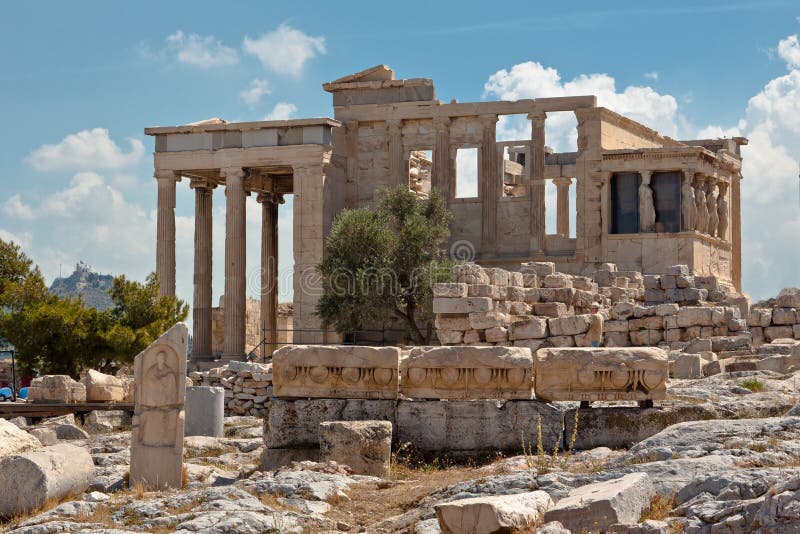 The Erechteion temple ruins with its doric columns and the Caryatids female statues, Acropolis, Athens, Greece. The Erechteion temple ruins with its doric columns and the Caryatids female statues, Acropolis, Athens, Greece.