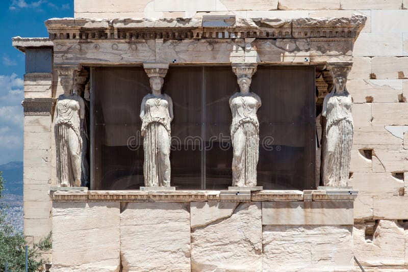 The Caryatids female statues with veils in the Erechteion temple ruins, Acropolis, Athens, Greece. The Caryatids female statues with veils in the Erechteion temple ruins, Acropolis, Athens, Greece.