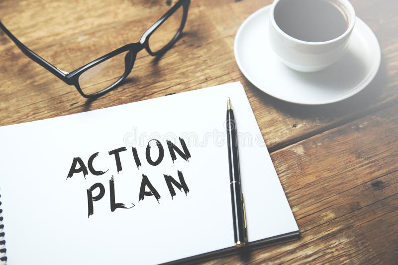 Action plan text on notepad royalty free stock photo