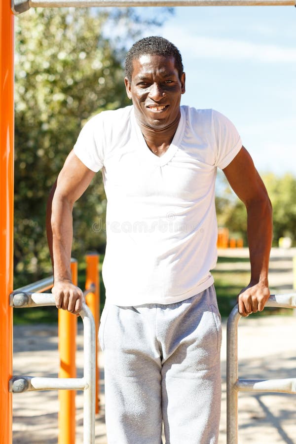 Active African American Man Doing Workout at Pullup Bar in Park Stock Image Image of athlete