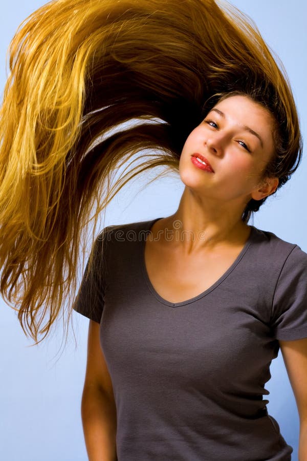 Active beautiful woman with long moving hair