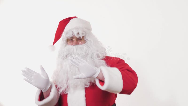 Active Cheerful Stylish Santa Claus Positively Dances, Haves Fun to Energetic Music Looking at Camera, Standing on White