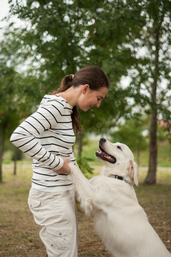 Dog and girl play togheter stock image. Image of cheerful 19760345