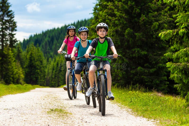 Active people - mother and kids biking. Active people - mother and kids biking