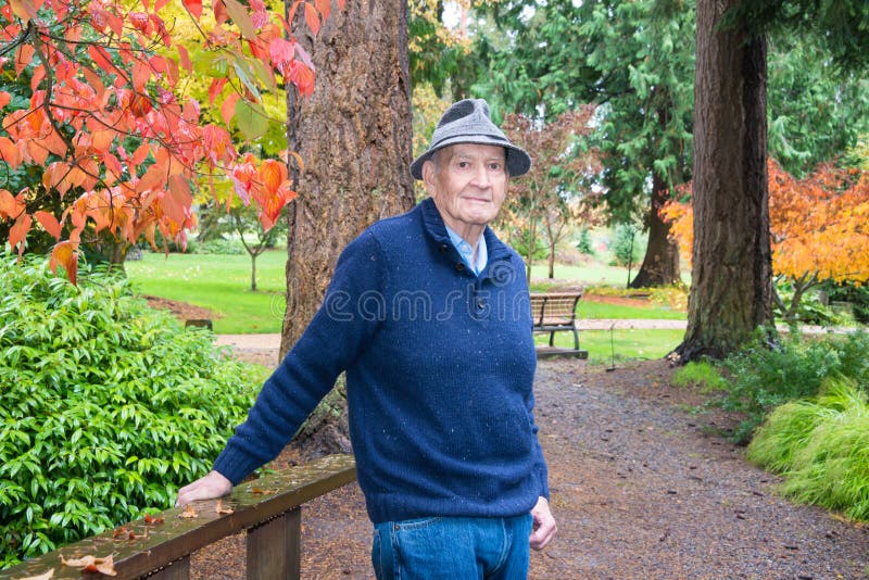 Active Senior in Arboretum and Garden in Autumn