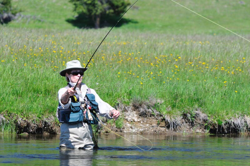 Active senior female fishing portrait