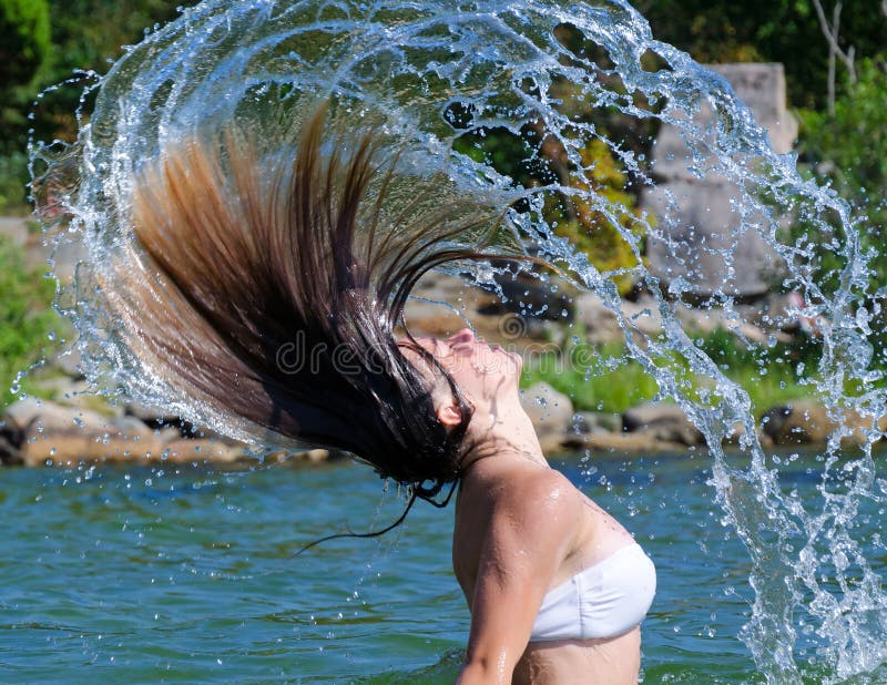 Active teenager sea water splashing