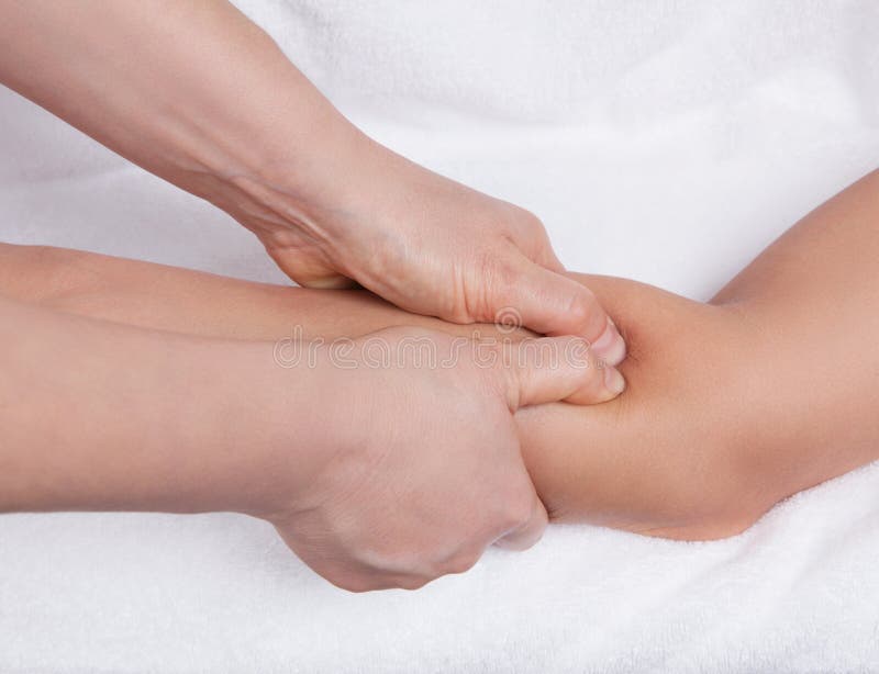 An acupressure point and massage treatment on a forearm