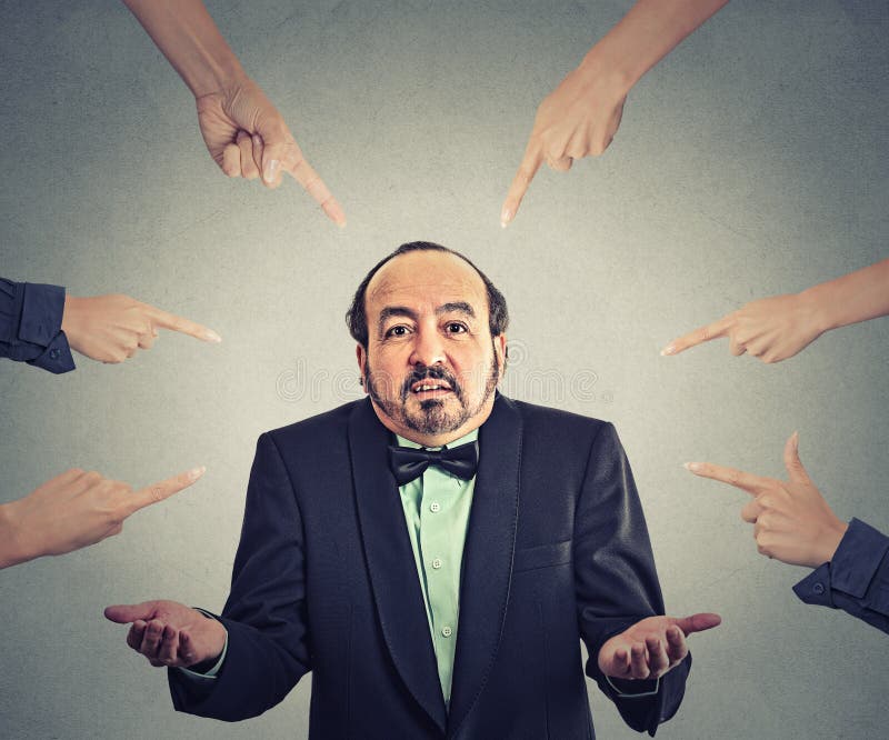 Concept of accusation of guilty arrogant businessman. Middle aged man judged by different people many woman fingers point at him. Guy shrugs shoulders. Concept of accusation of guilty arrogant businessman. Middle aged man judged by different people many woman fingers point at him. Guy shrugs shoulders