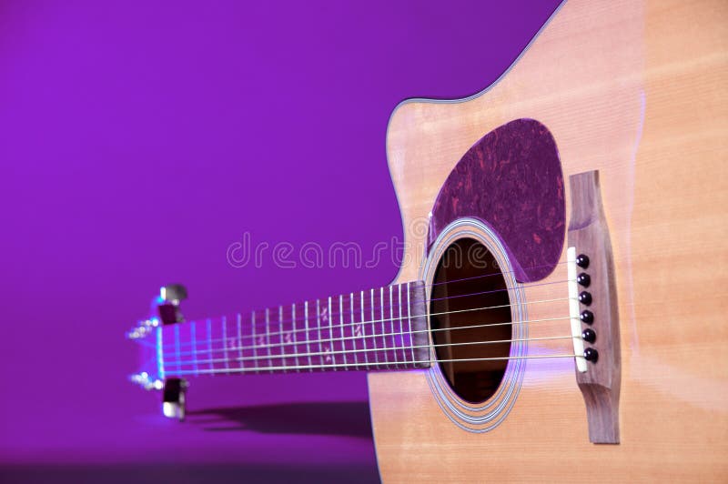 Acustic Guitar Isolated On Blue