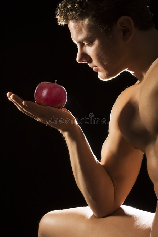 Adam looking at an apple