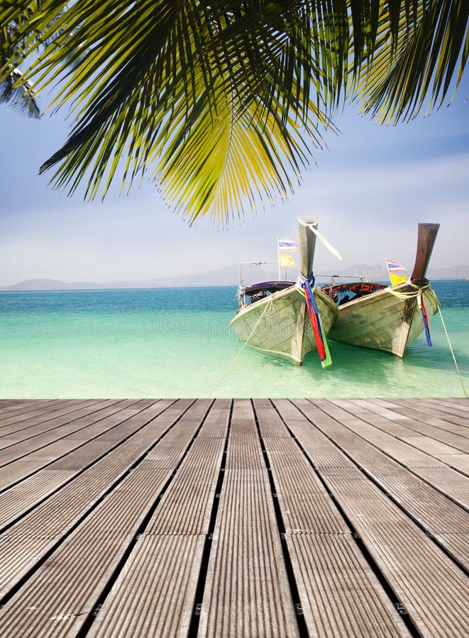 Adaman sea and wooden boat in Thailand