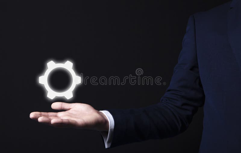 Adapta el icono en mano del hombre de negocios foto de archivo libre de regalías Adapta el icono en mano del hombre de negocios foto de archivo libre de regalías