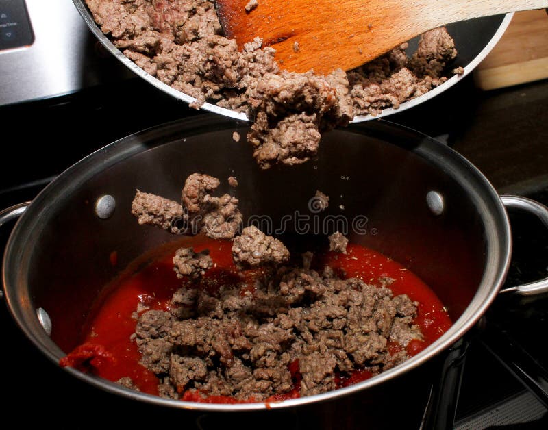 Adding Ground Beef To the Tomato Sauce. Stock Image Image of culinary