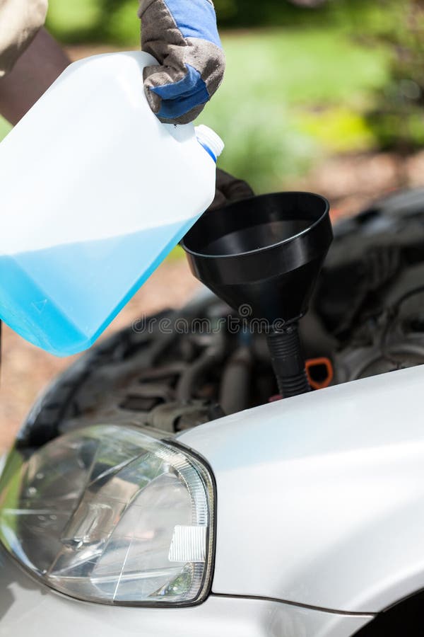 Man Pouring Liquid from Plastic Canister into Car Washer Fluid Reservoir, C  Stock Image - Image of canister, motor: 154937505