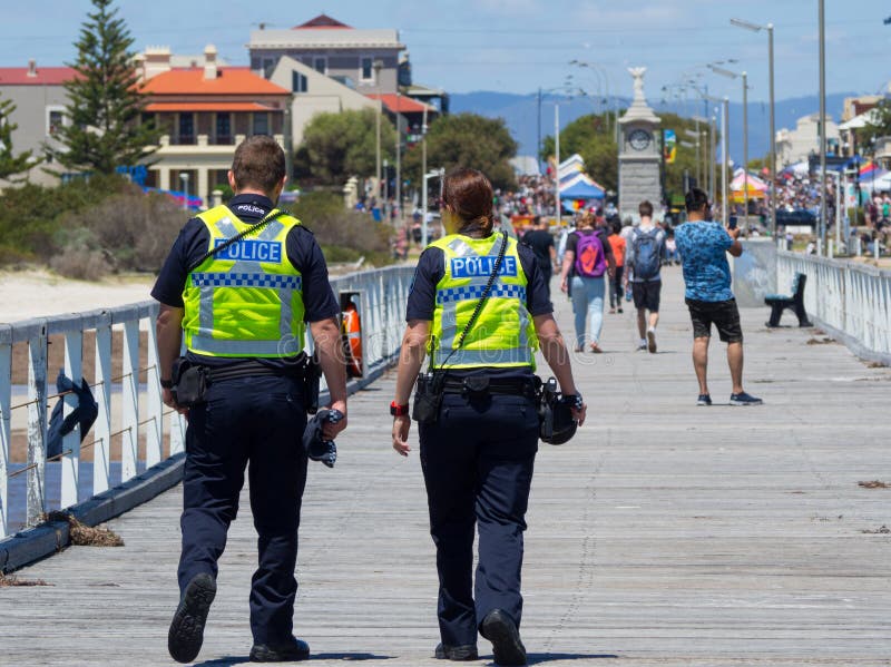 Two South Australia Police officer working on duty at Semaphore Beach.