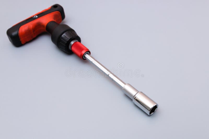 Adjustable Spanners Set with Red Holder Over a Grey Background. Father