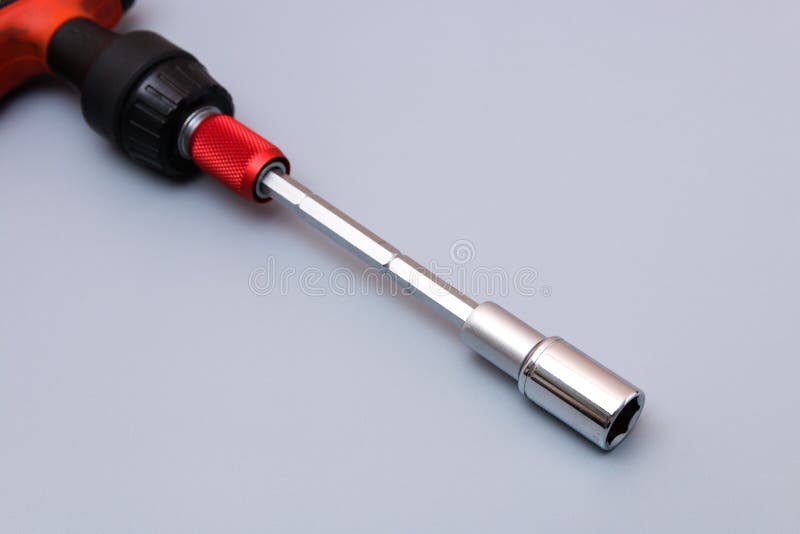 Adjustable Spanners Set with Red Holder Over a Grey Background. Father