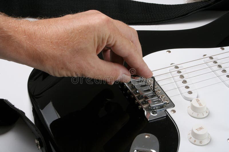 Adjusting electric guitar stock image. Image of 73583541