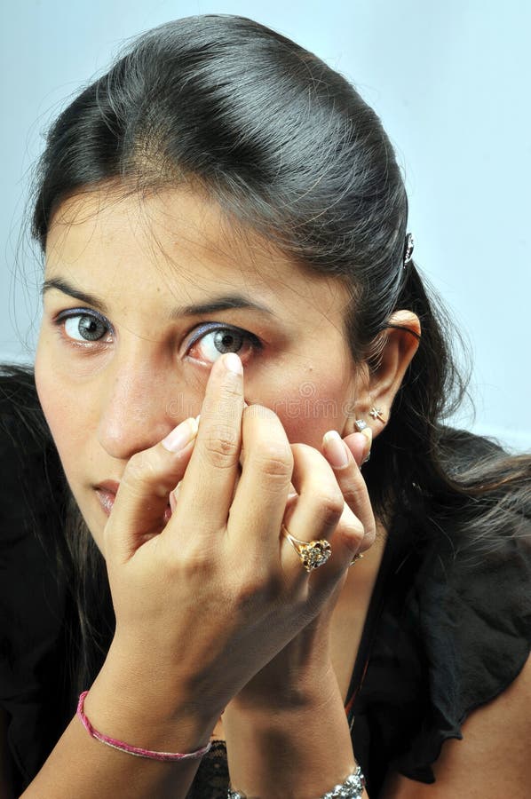 Adjusting eye lens stock image. Image of studio, golden 11135693