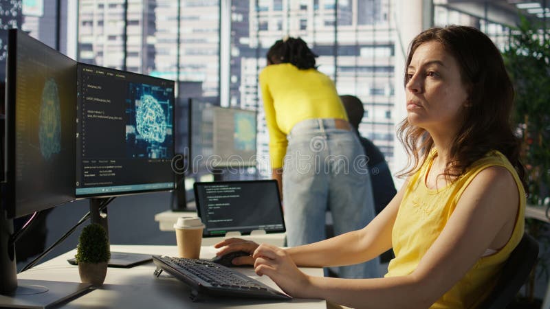 Admin tests on computer and tablet to optimize artificial intelligence tech stock images