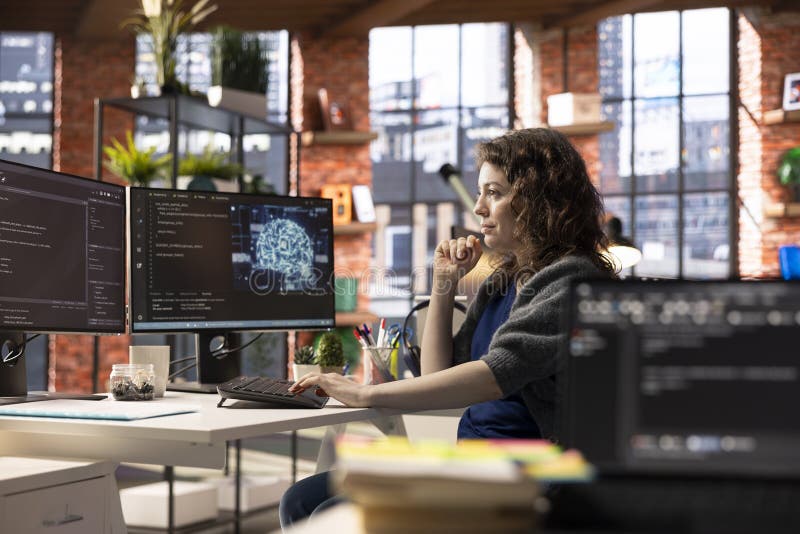 Admin writing code on PC and doing maintenance on artificial intelligence royalty free stock photo