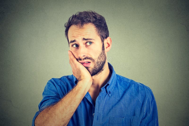 No motivation in life. Sad worried man isolated on gray wall background. No motivation in life. Sad worried man isolated on gray wall background