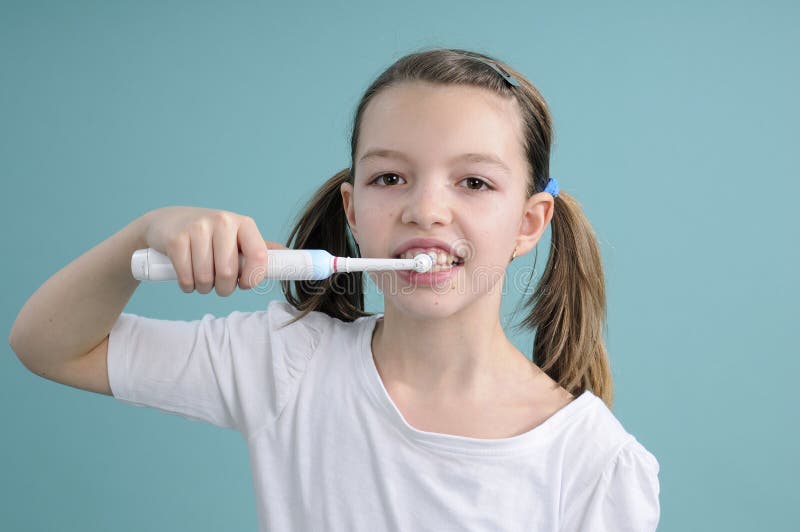 Adolescent washing teeth