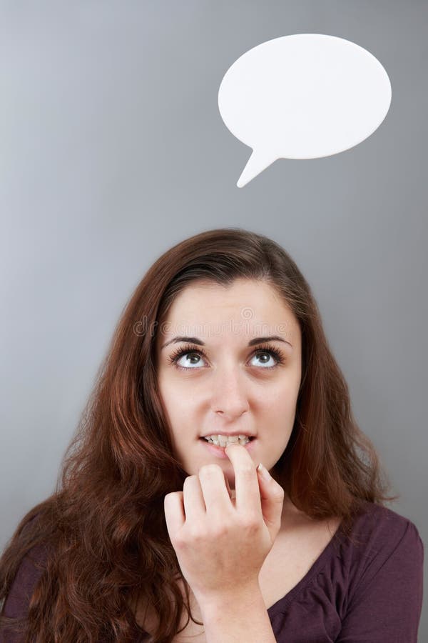 Adolescente ansioso con la testa di cui sopra della bolla di pensiero immagini stock Adolescente ansioso con la testa di cui sopra della bolla di pensiero immagini stock