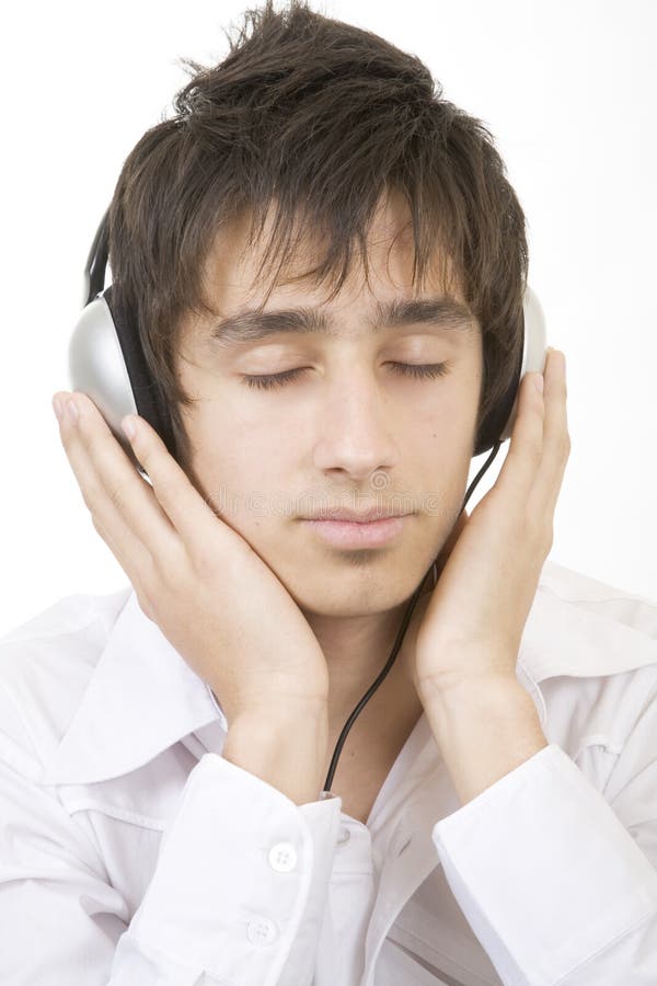 Adolescente che ascolta la musica immagine stock Adolescente che ascolta la musica immagine stock