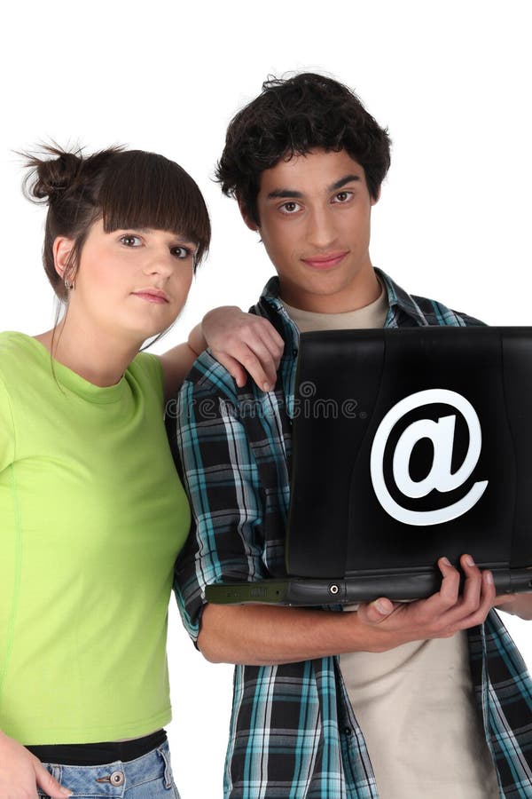 2 teenagers surfing the internet. 2 teenagers surfing the internet