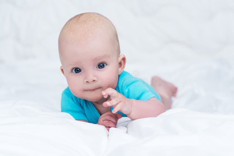 Adorable Baby Girl Or Boy In Blue Shirt With Big Blue Eyes, Indoors ...