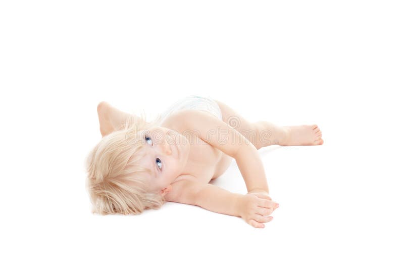 Adorable baby girl lying down and looking up